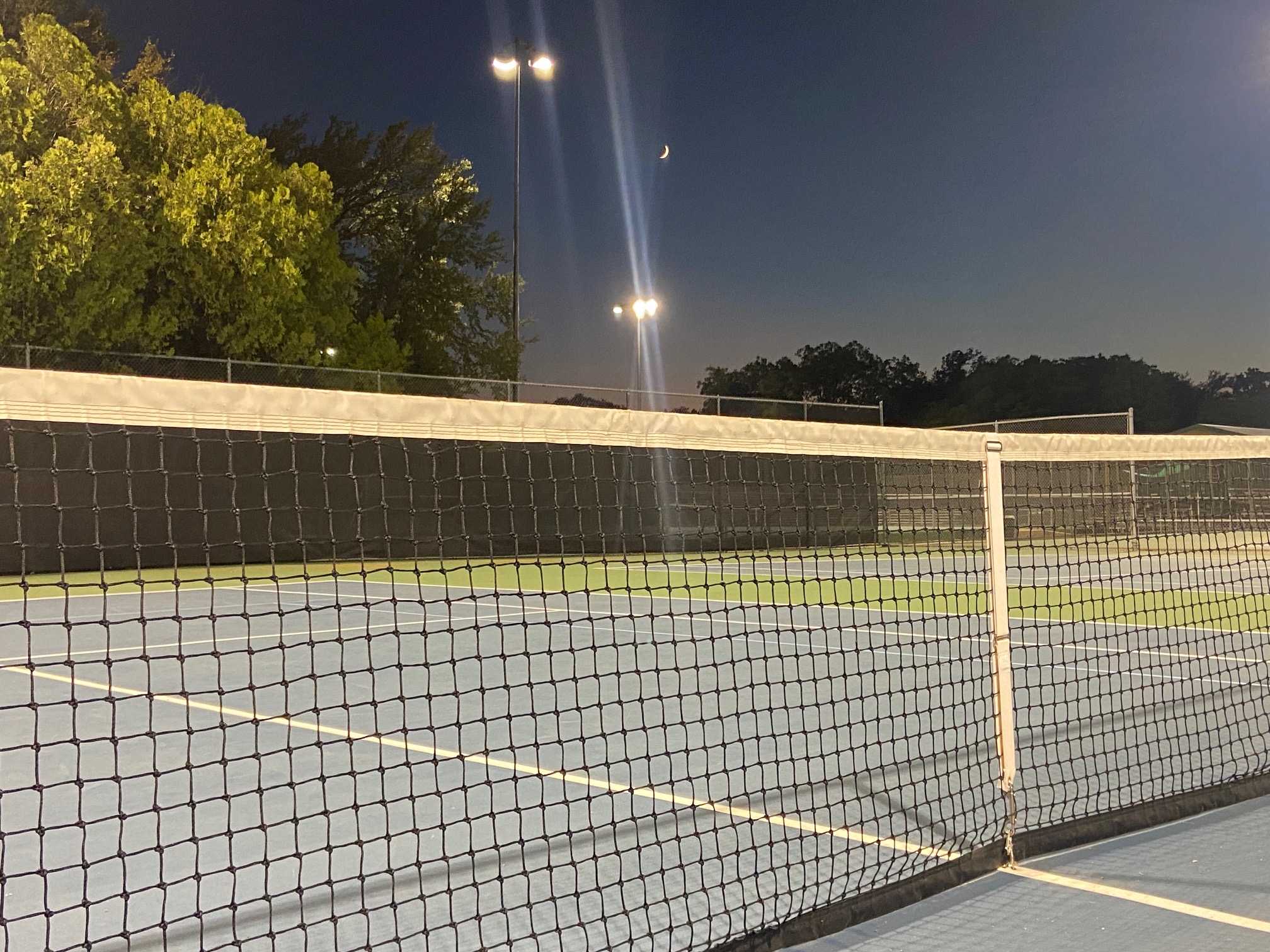 Crescent Moon Over Empty Tennis Court