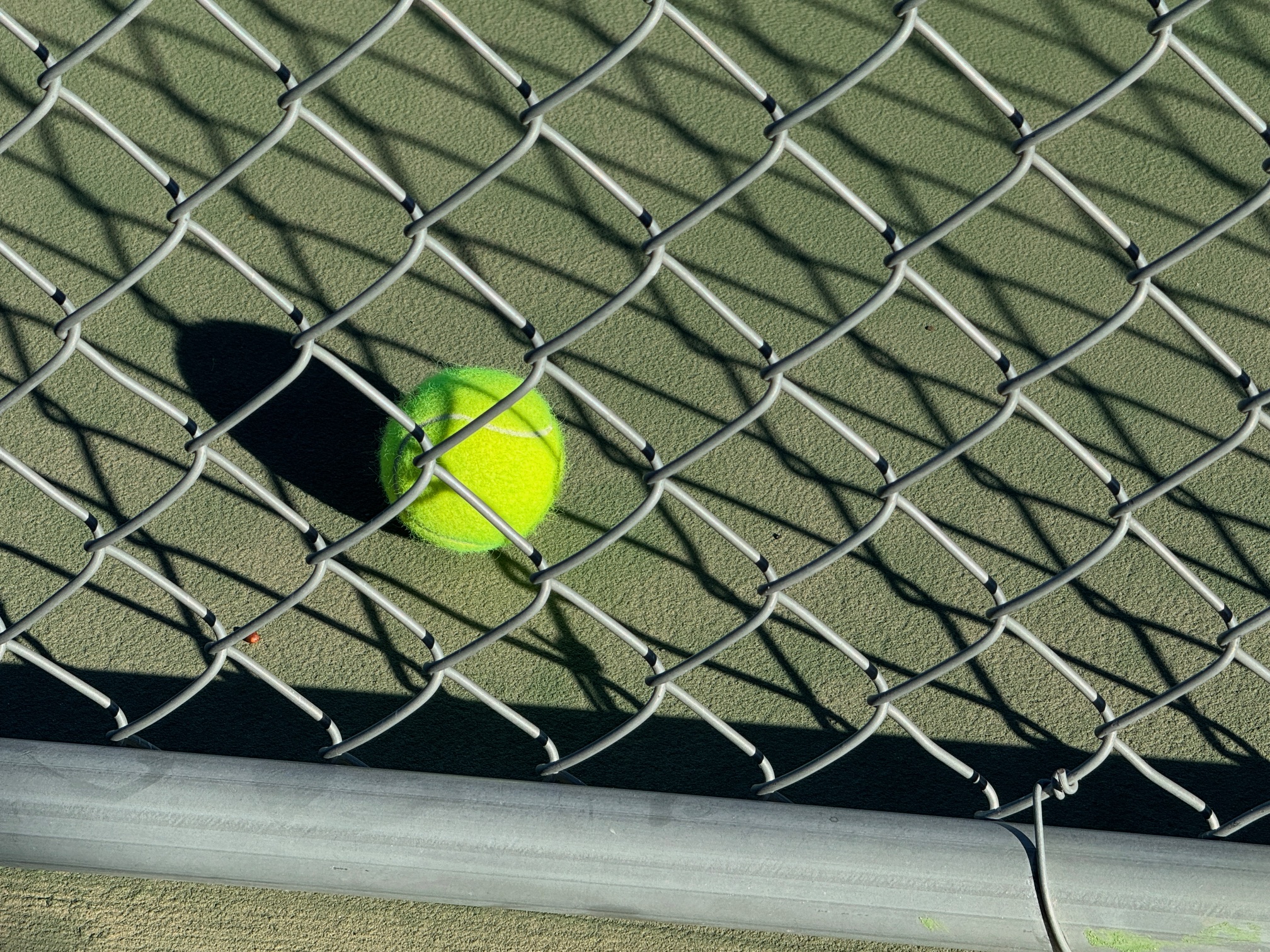 Ball next to fence