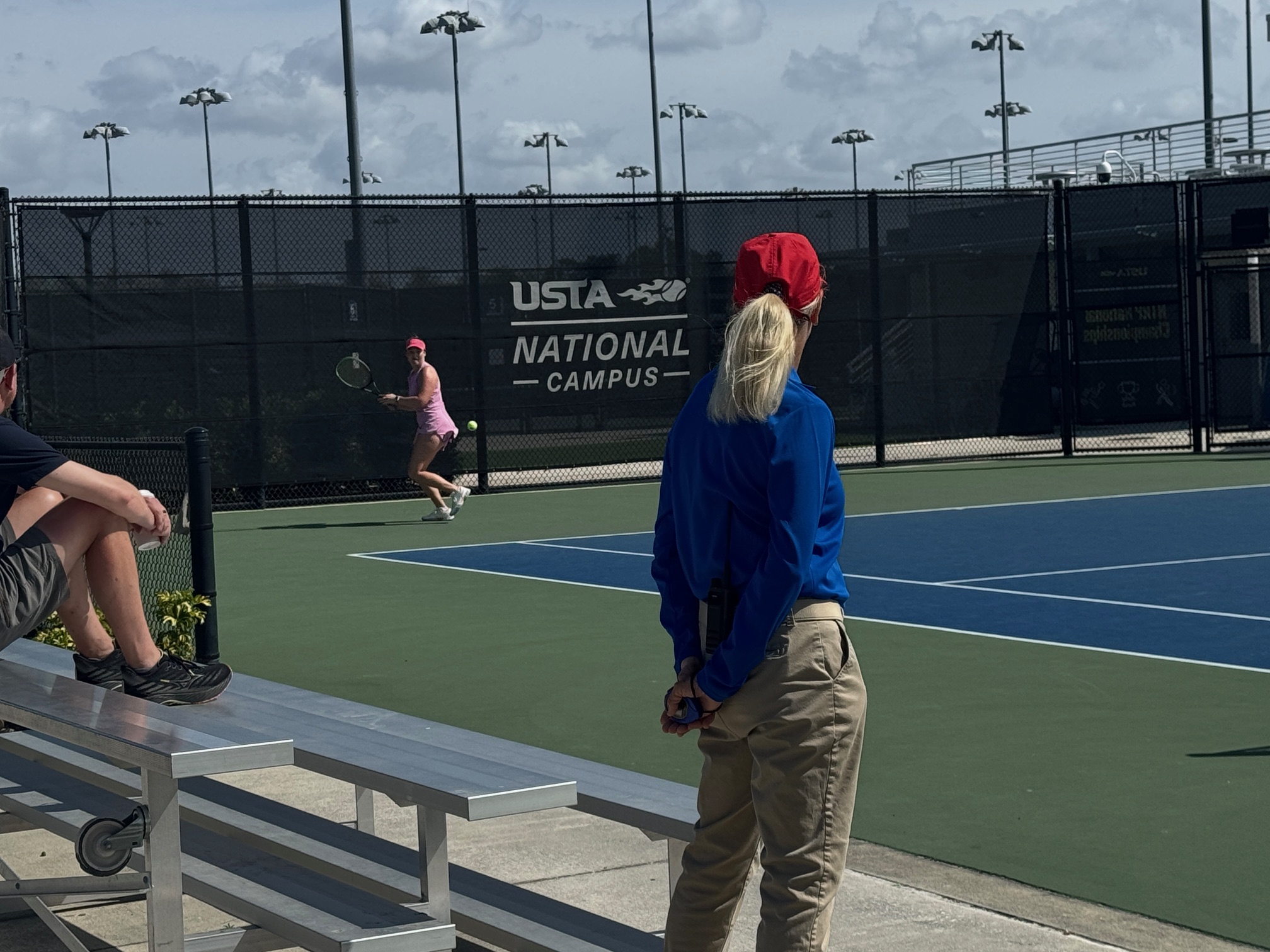 USTA official watching a match at the USTA National Campus