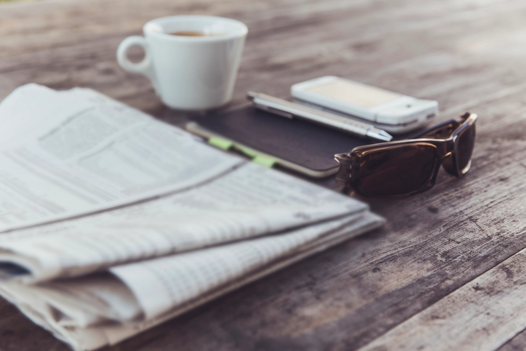 Cup coffee newspaper