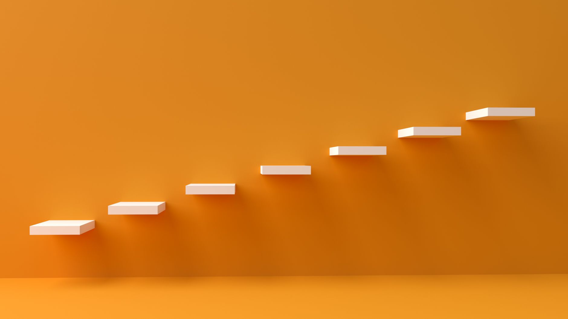 while ladder attached to the orange wall