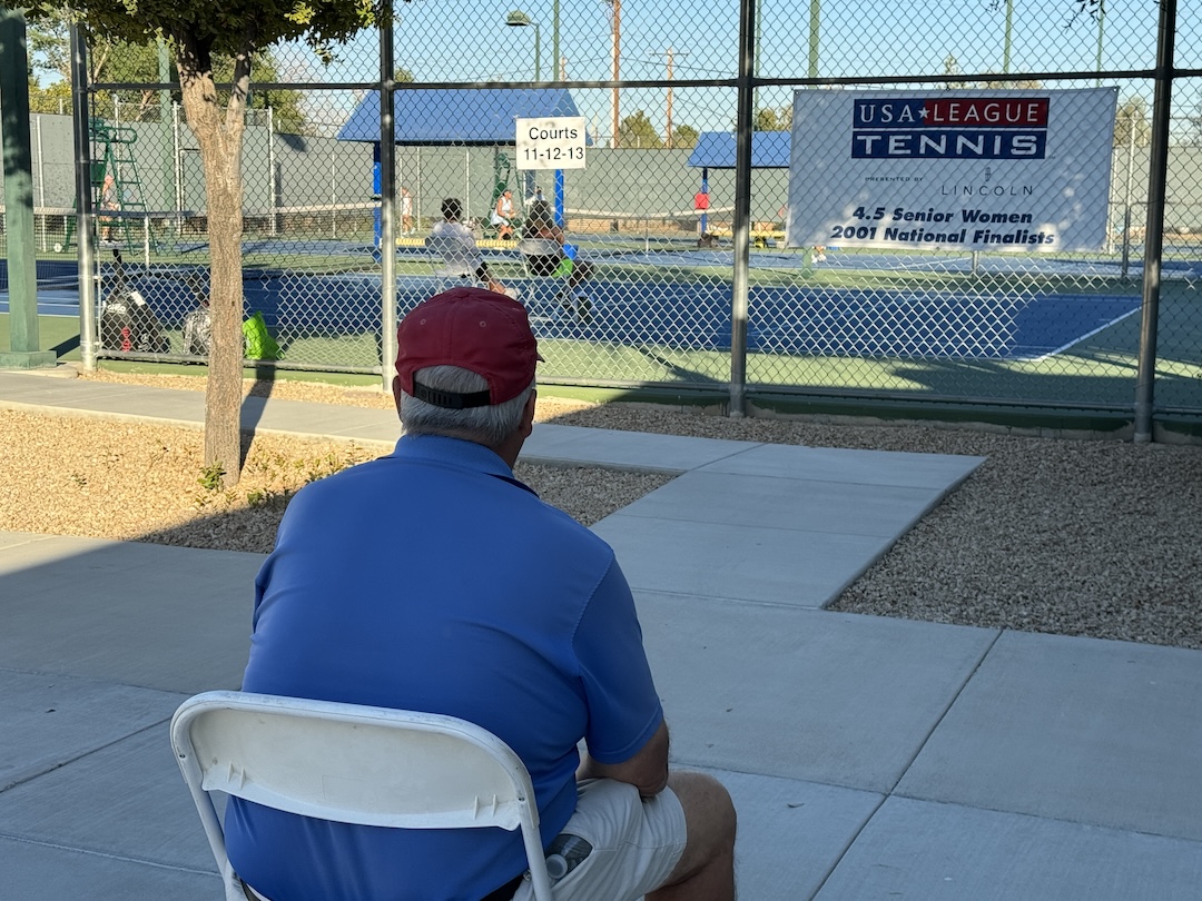 Umpire positioned on a baseline.