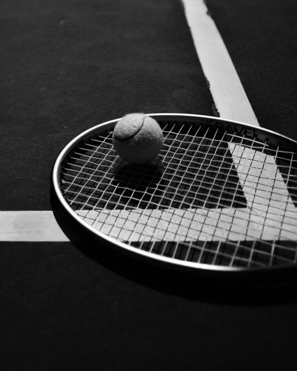 tennis ball on racket